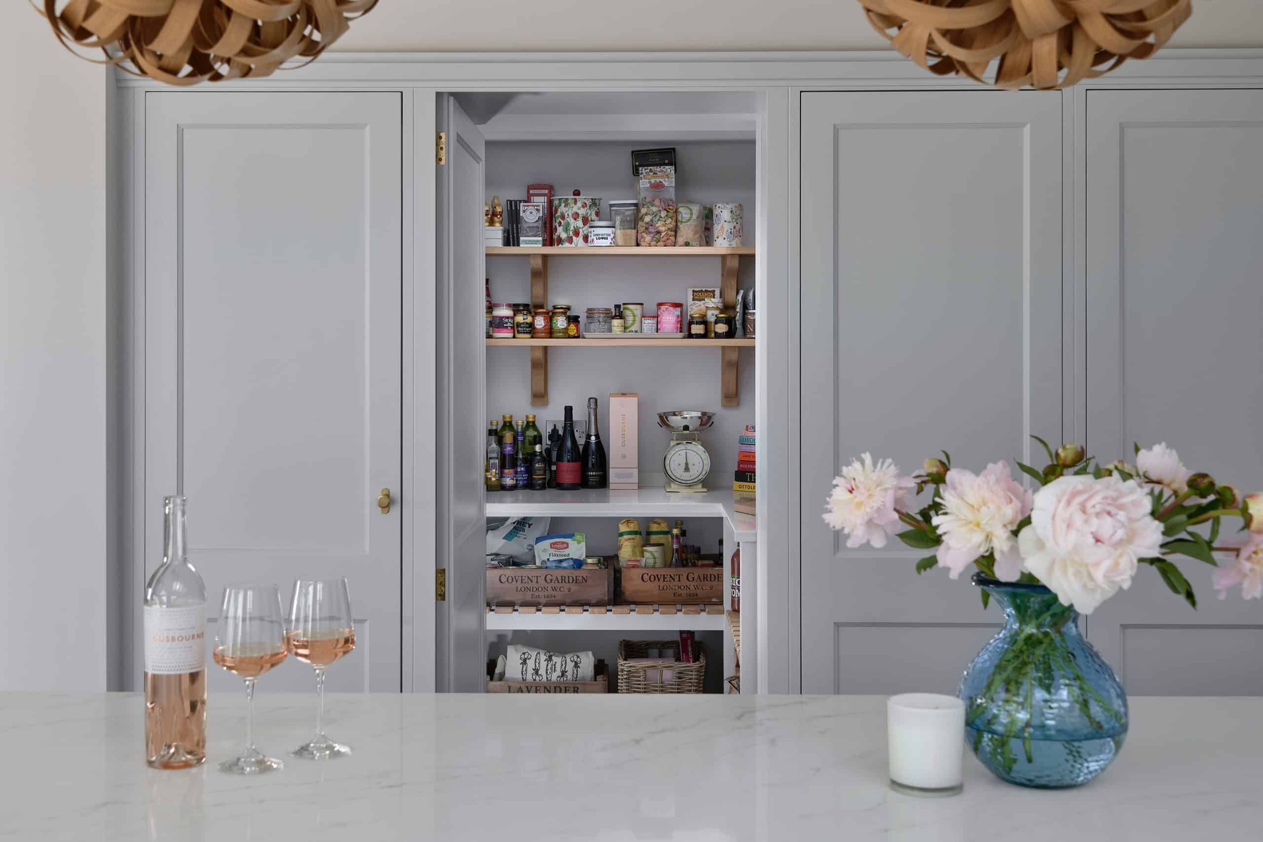Grey painted shaker kitchen secret door with walk in pantry